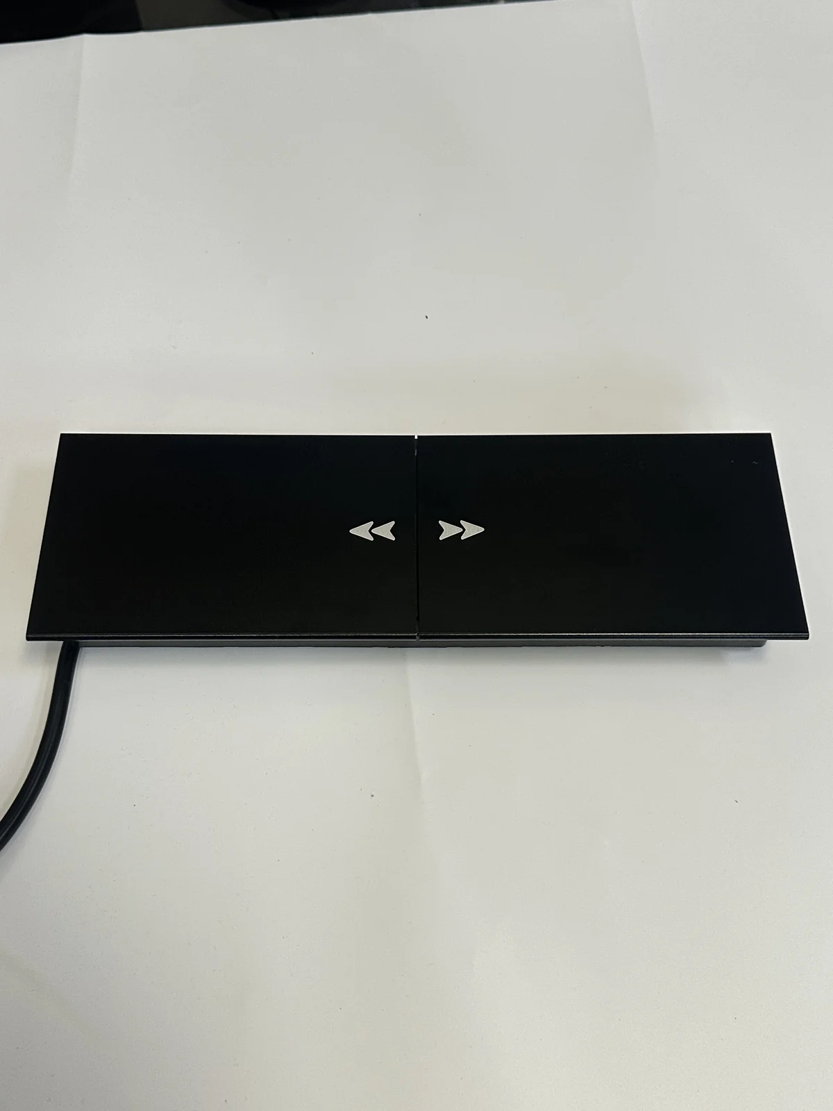 Closed sliding-cover recessed desk power module shown as a real product reference