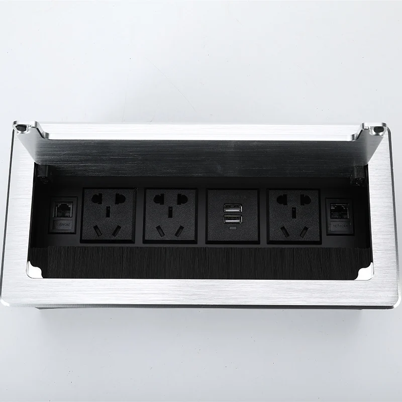 Top view of an open manual flip-cover desk power module